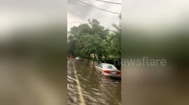 Cars left partially submerged on residential New Orleans street as Storm Barry hits