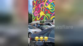 Man Taping Box on top of car
