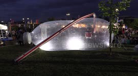 Massive plastic water bottle on display at community event in Markham Canada to promote plastic waste awareness and alternatives
