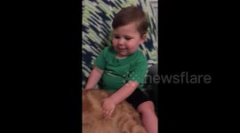 Chubby baby calls his cat chonky