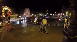 Funny scene of a Skateboarder spotted with crutches in Paris. 14 july 2019.