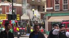 Clerkenwell fire - fireman dousing flames