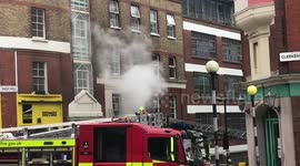 Clerkenwell Fire - fireman dousing flames 2