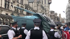 Cheers ring out as blue boat unveiled at London Extinction Rebellion protest