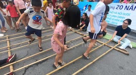 Children participated in Vietnamese Traditional Bamboo Dance In The Walking Street Of Ha Noi