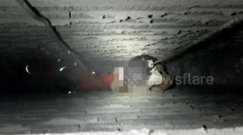 Chinese firefighters rescue girl trapped between walls after falling out of a flat