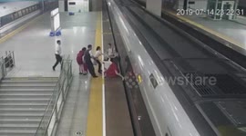 Chinese woman uses foot to prevent train from departing after arriving late to the station