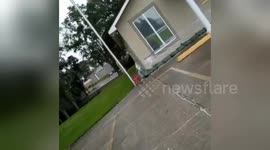 Mother comments on neighbour preparing for Storm Barry by wrapping house with plastic