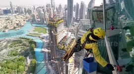 Fearless workers risk their lives cleaning the windows of the world's tallest skyscraper in Dubai