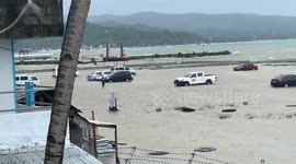 Dozens of tourists' cars stranded on beach flooded by Storm Danas in the Philippines