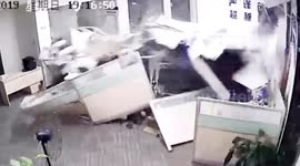 Chinese woman accidentally slams car into office injuring two people