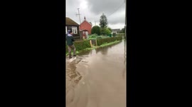 Walking through the flooded streets in Wainfleet