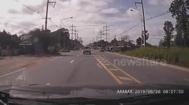 Truck in Thailand tries to cut off other drivers but immediately flips over and crashes