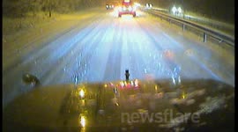 Snow on A23 11th March Cars turn back into oncoming traffic