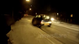 Cars stuck in snow on Rye Hill, Rye, East Sussex
