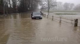 BMW trapped in flood in St Neots, Cambs