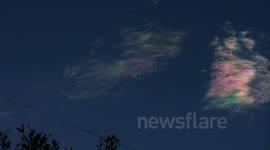 Cool iridescent cirrus clouds passing zoomed timelapse V10853a