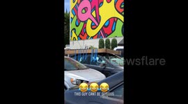 LA man seen precariously taping box to roof of car then driving off