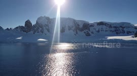 Cruise ship glimpses pristine Antarctic landscape after making treacherous crossing