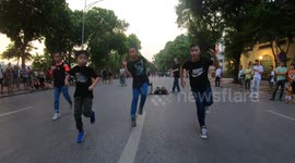 Japanese children with great dancing on the walking street in Vietnam