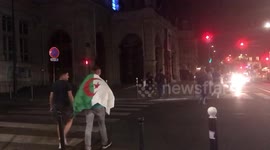 Algeria fan wearing flag to celebrate Africa cup win in Paris