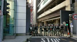 Hong Kong police in riot gear outside police headquarters in Wanchai district