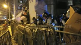 Hong Kong riot police charging out of Western police station which had been barricaded by protesters in Hong Kong during an anti extradition protest on 21st July 2019