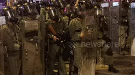 Closeup footage shows Hong Kong riot police firing tear gas towards protesters