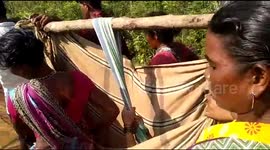 Woman in labour carried to ambulance in makeshift sling by family and neighbours in India