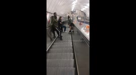 A group of young kids jumps the tickets barrel without paying