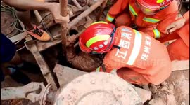 Chinese firefighters rescue worker trapped in a concrete pipe after falling down well