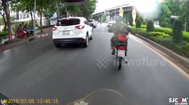 Bizarre moment bulldog chases man across dual carriageway