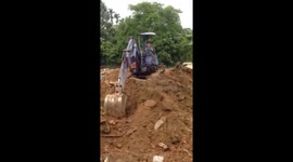 Big boy's toys! Vietnamese seven-year-old learns to drive excavator to help his father