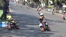 Indonesian mini-Moto Grand Prix sees tiny racers crash around course