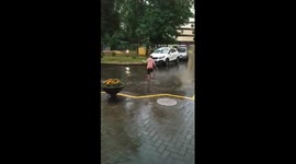 Happy child running in the rain