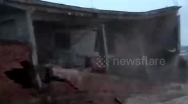 Flood-hit building crumbles like a house of cards in northern India