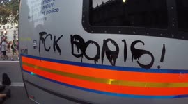 Police cars vandalised as they hold out against anti-Boris Johnson protest in London