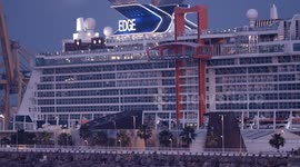 The large cruise ship Celebrity Edge in Barcelona port at sunrise