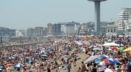 Brighton beach packed with people making the most of UK heatwave
