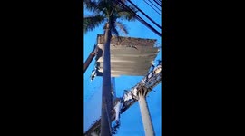 Workers Repair Billboard Damaged In Bangkok Storm