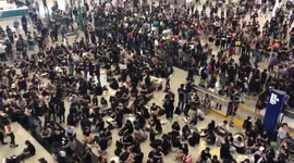 Protesters at Hong Kong airport shout 'Go Hong Kong' in Friday protest