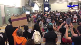 Hong Kong airport protesters chant “Free Hong Kong!”