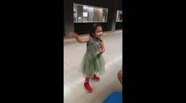 adorable girl sing and dance baby shark at train station