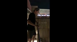 Pukes off casino balcony