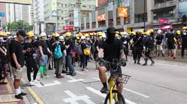 Black-clad protesters gather after Hong Kong police fired tear gas