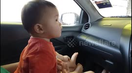 Adorable toddler is terrified of automatic car washing machine