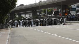 Tense standoff between Hong Kong protesters and police near China Liaison Office
