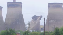 Power station cooling tower is demolished in the north of England