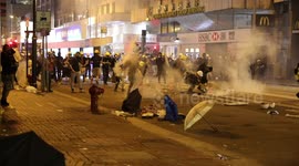 Hong Kong protesters in Central throw tear gas canisters back at police