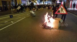 Hong Kong protesters hurl sticks at police van